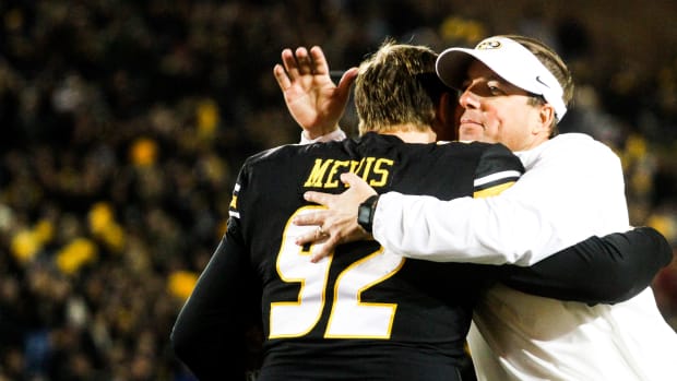 Missouri head coach Eli Drinkwitz hugs Harrison Mevis during the senior day festivities before a college football game at Memorial Stadium on Nov. 18, 2023, in Columbia, Mo.